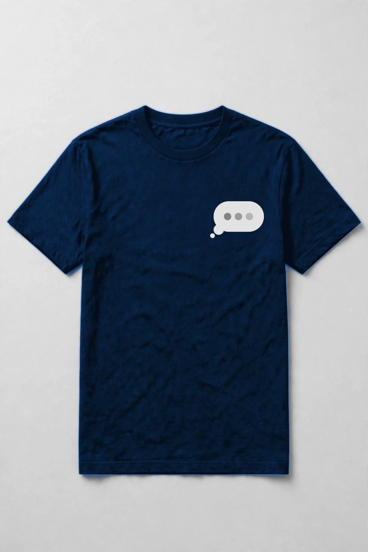 Typing dots shirt front chest print - small typing bubble left chest print on true royal Bella Canvas tee, shirt only flat lay
