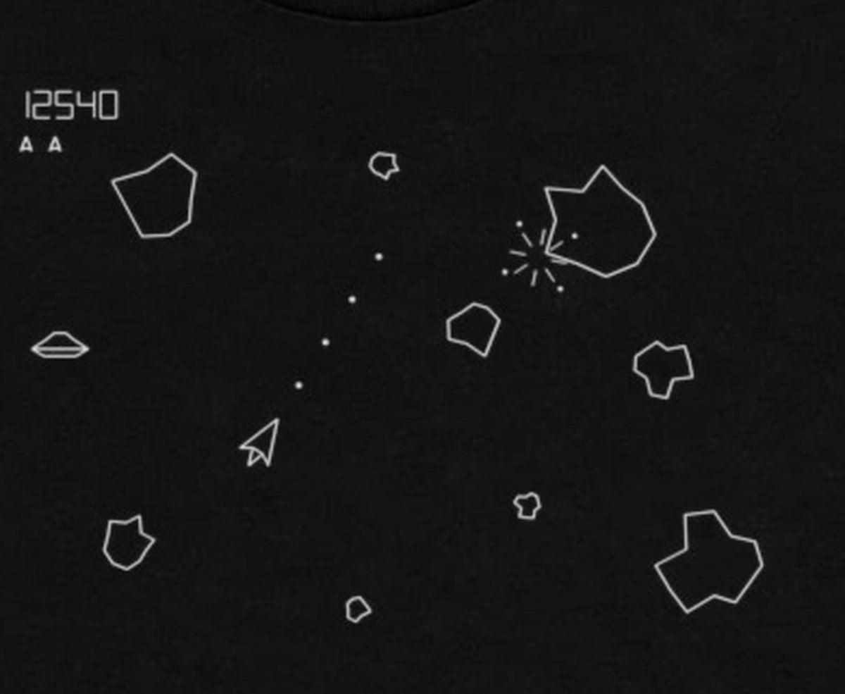 Asteroids shirt design close-up - vector ship, bullet stream and rock explosion print detail with 12540 score