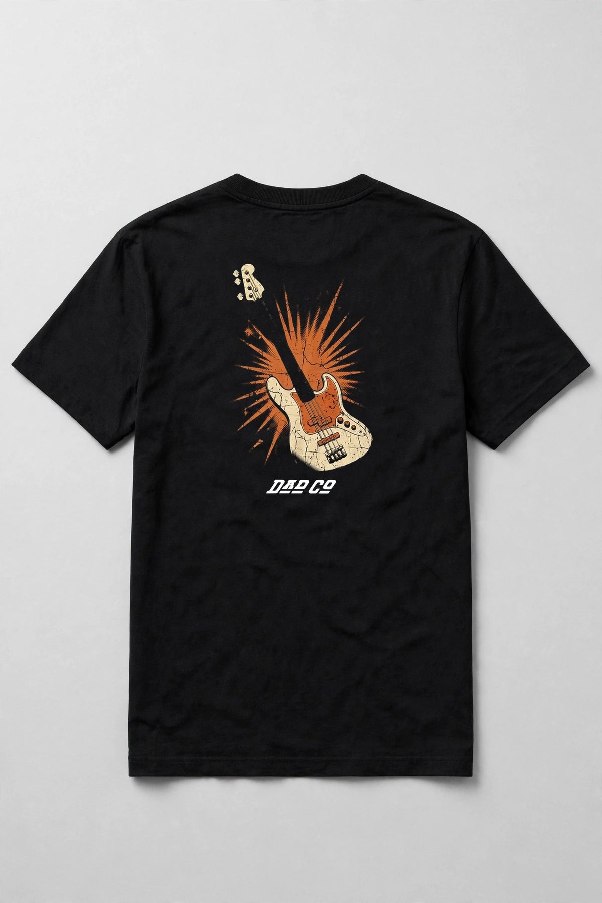 Black bass player t-shirt back print: vintage cream and burnt orange bass guitar with starburst, distressed screen print, with DAD CO logo under the back print