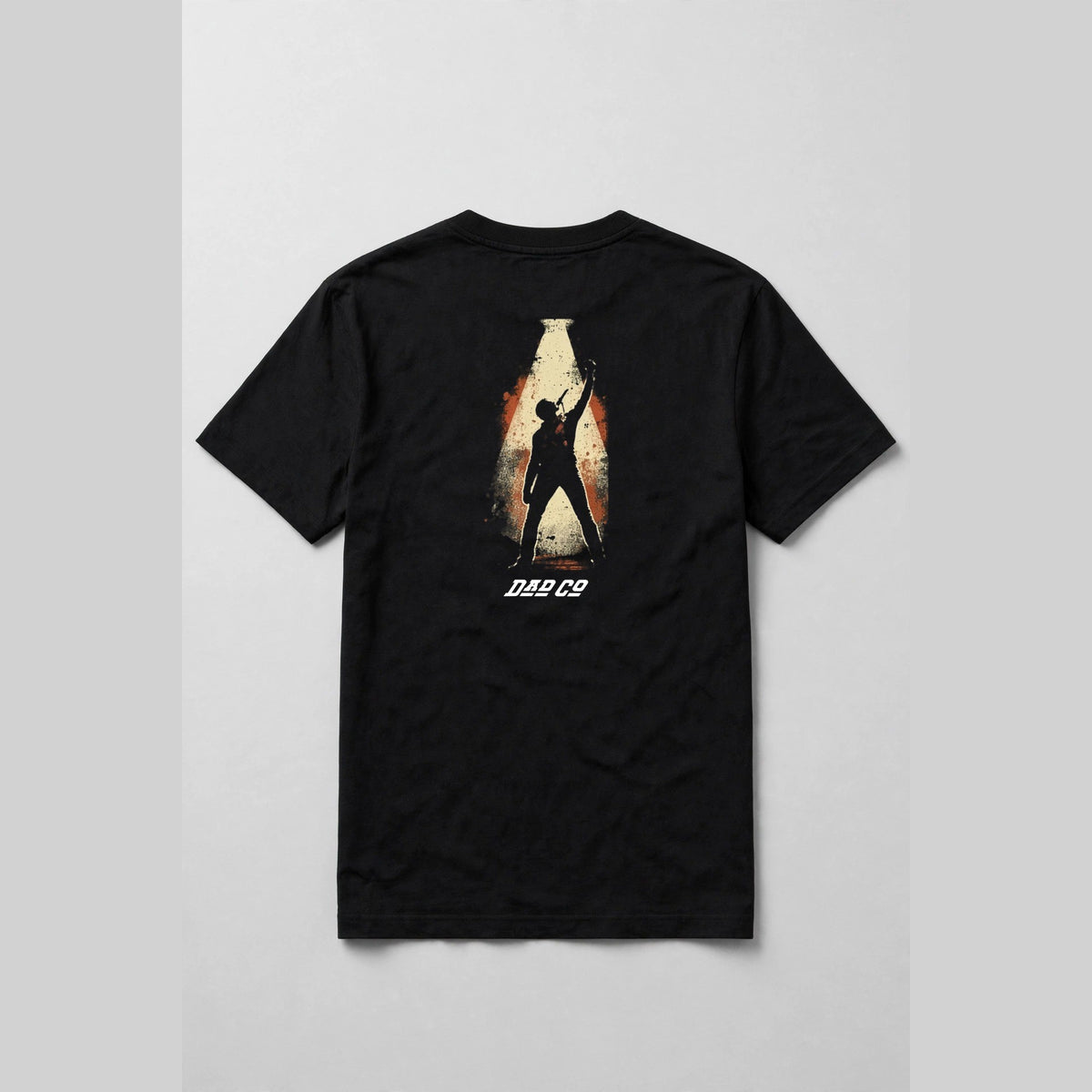 Black singer t-shirt back print: vocalist silhouette holding a vintage microphone inside a cream spotlight, burnt orange distressed frame, with DAD CO logo under the back print