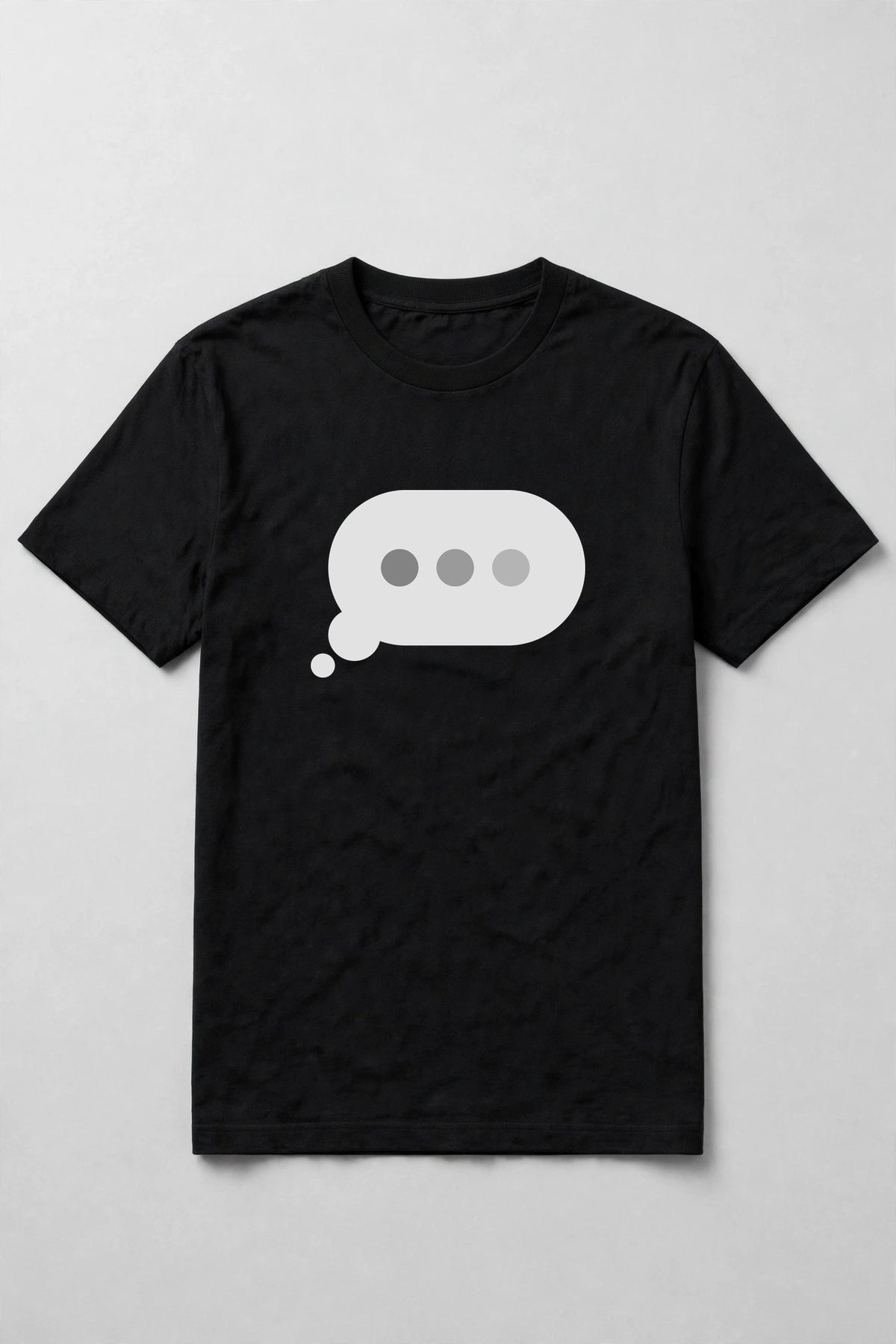 Typing dots shirt front print - big typing bubble with three dots front and center on black Bella Canvas tee, shirt only flat lay
