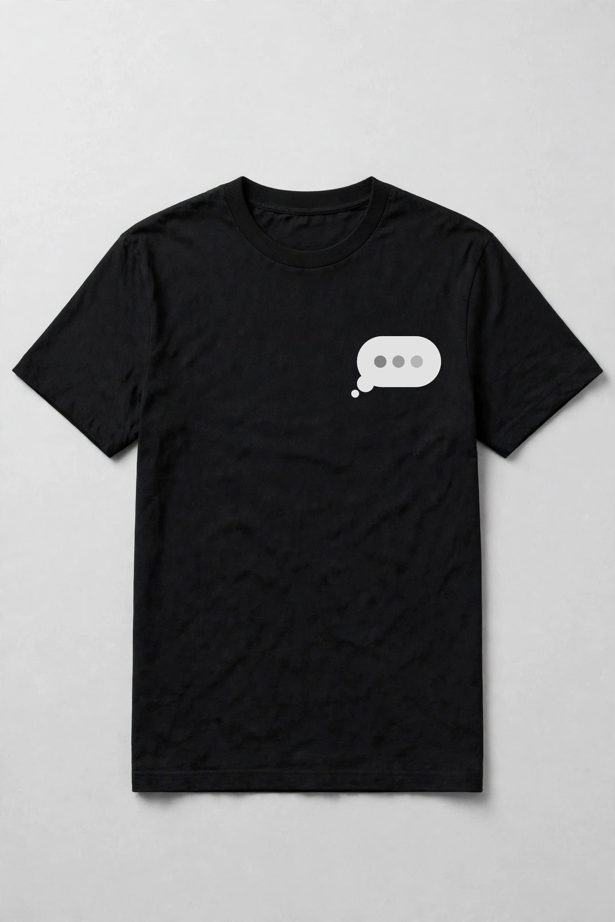 Typing dots shirt front chest print - small typing bubble left chest print on black Bella Canvas tee, shirt only flat lay