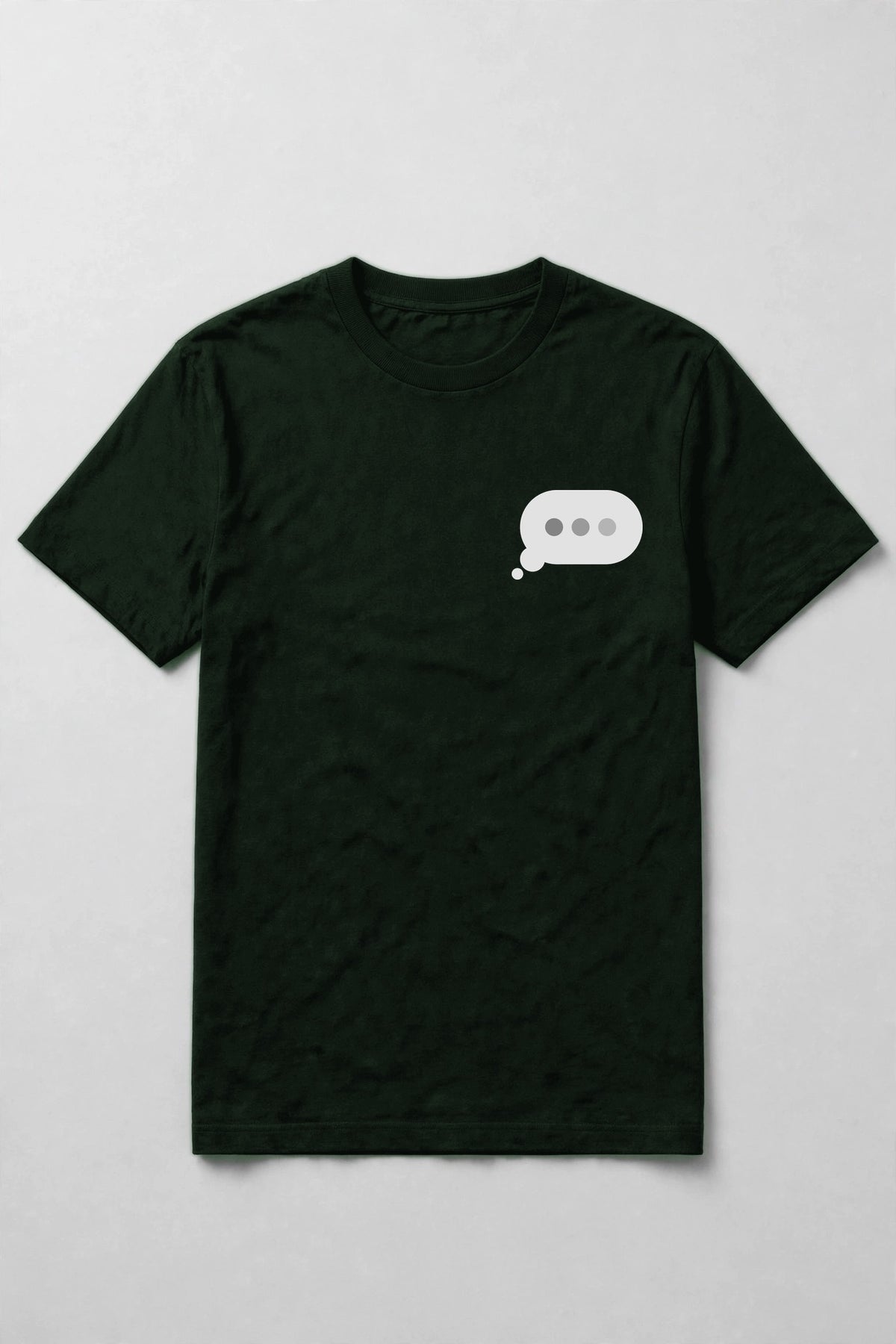 Typing dots shirt front chest print - small typing bubble left chest print on forest Bella Canvas tee, shirt only flat lay