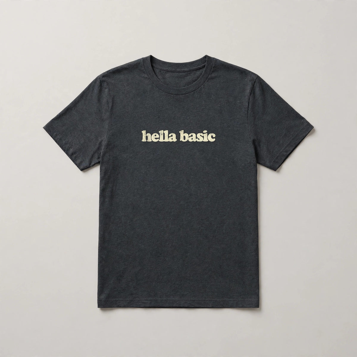 Hella Basic funny slang t-shirt in Dark Grey Heather - distressed cream lowercase text, Bella Canvas tee, flat lay front view, funny sarcastic humor shirt
