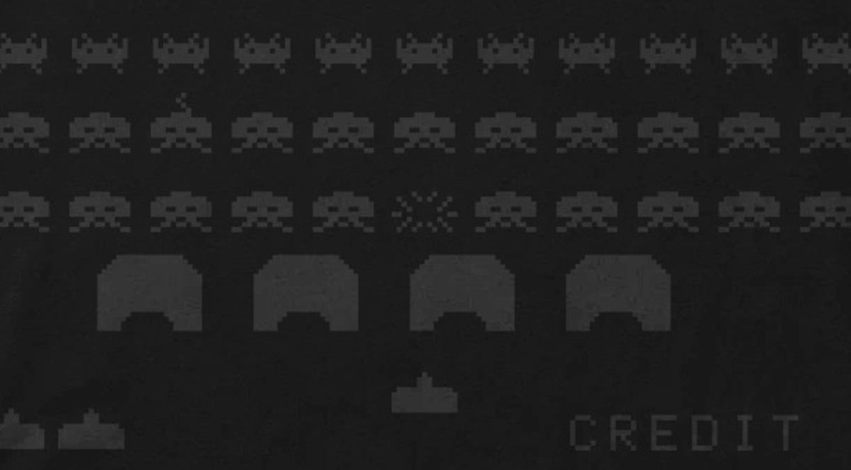 Space Invaders shirt design close-up - invader rows, exploding invader, bunker shields and laser cannon print detail