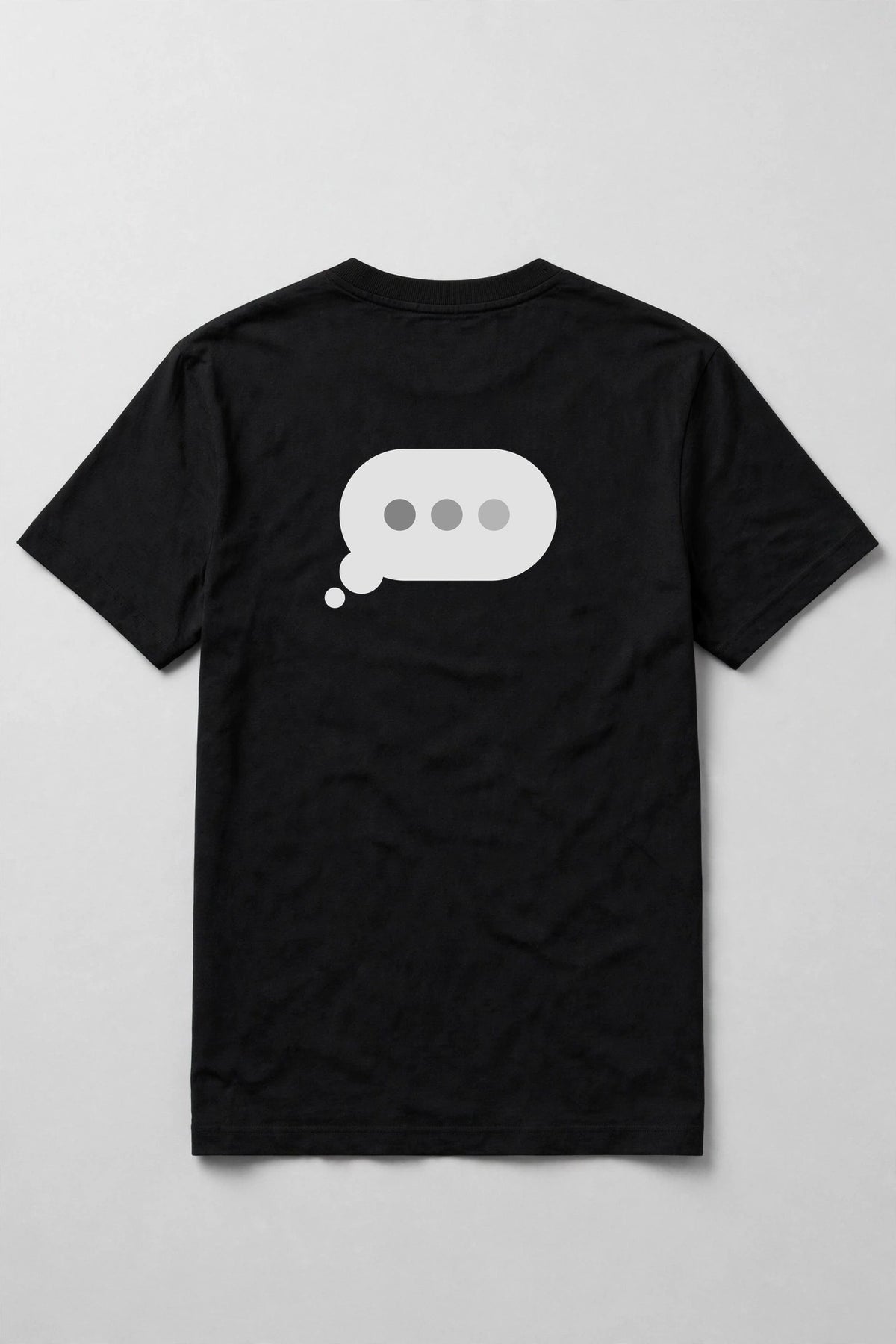 Typing dots shirt back print - typing bubble with three dots back print on black Bella Canvas tee, shirt only flat lay