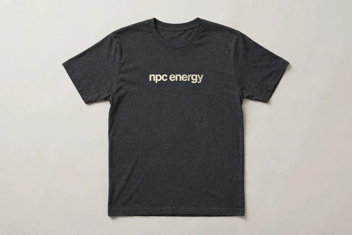 NPC Energy funny gamer slang t-shirt in Dark Grey Heather - distressed cream lowercase text, Bella Canvas tee, flat lay front view, funny gaming humor shirt